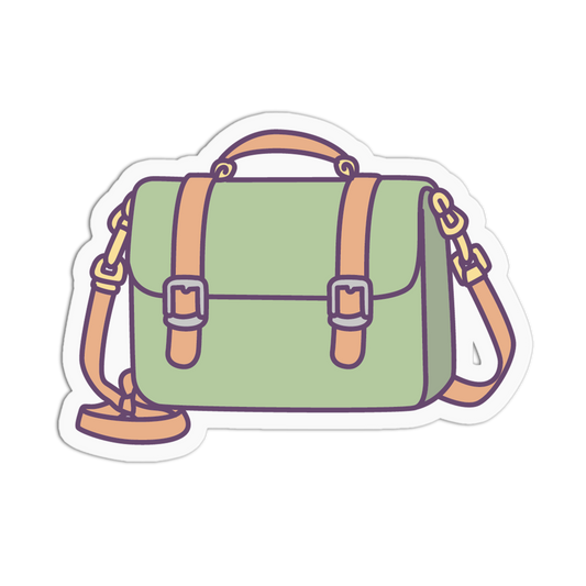 A die-cut sticker featuring a stylized illustration of a sage green satchel bag with peach-colored straps and trim, outlined in dark purple, on a plain white background.