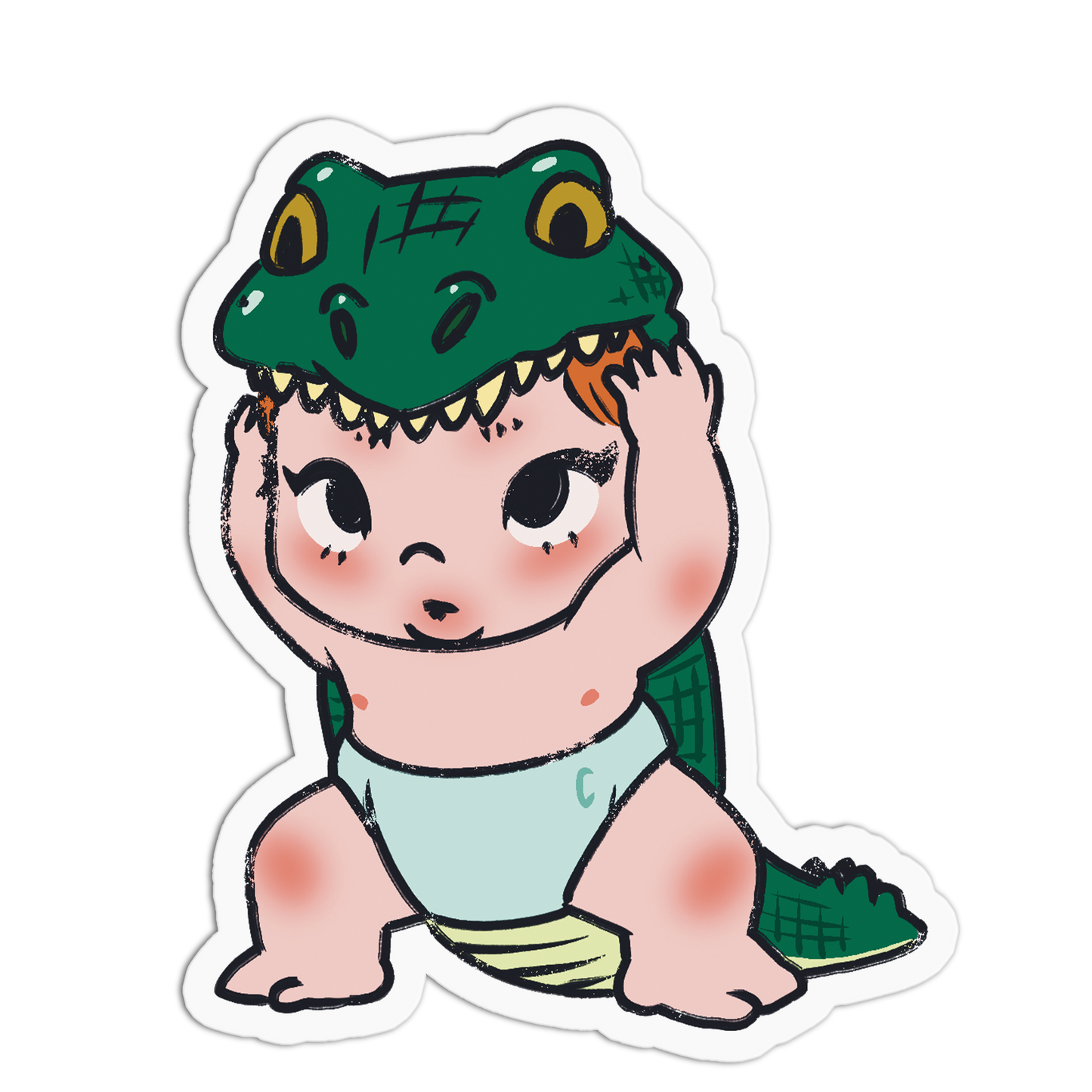 A cartoon-style die-cut sticker of a baby wearing a green alligator or crocodile hood, with a pale blue diaper, on a plain white background.