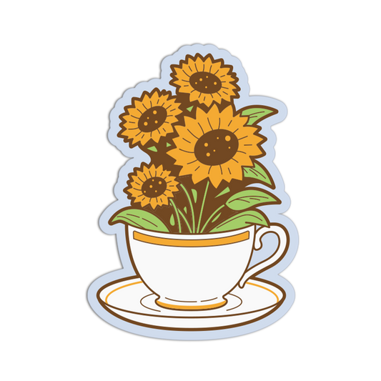 A die-cut sticker featuring a white teacup and saucer with gold trim, filled with yellow sunflowers and green leaves, shown on a plain white background.