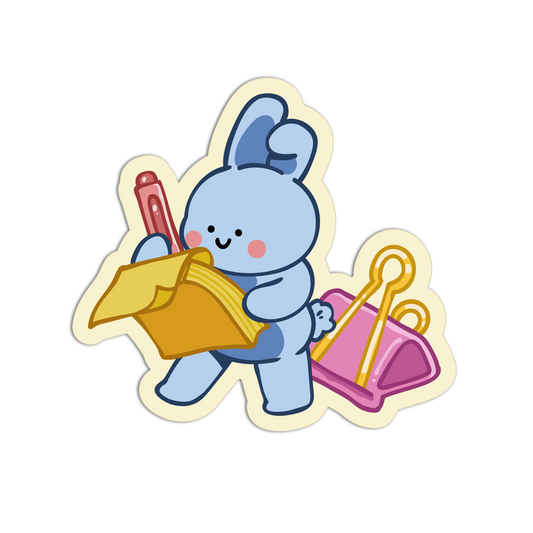 A die-cut cartoon sticker featuring a light blue bunny holding a yellow folder and a red pen, with a pink pouch behind it, shown on a plain white background.