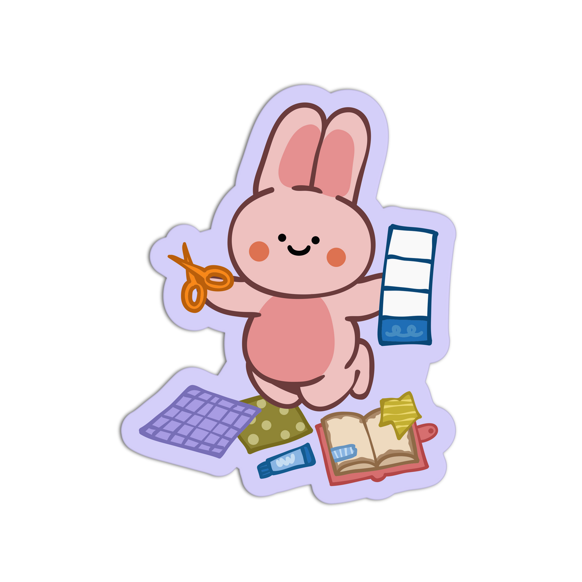 A cartoon bunny sticker or decal on a plain white background. The bunny is pink with orange cheeks and a black smiling mouth, holding orange scissors and a blue-and-white ruler.
