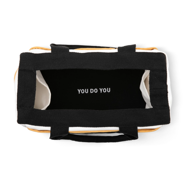 Black bag with 'YOU DO YOU' text on a white background