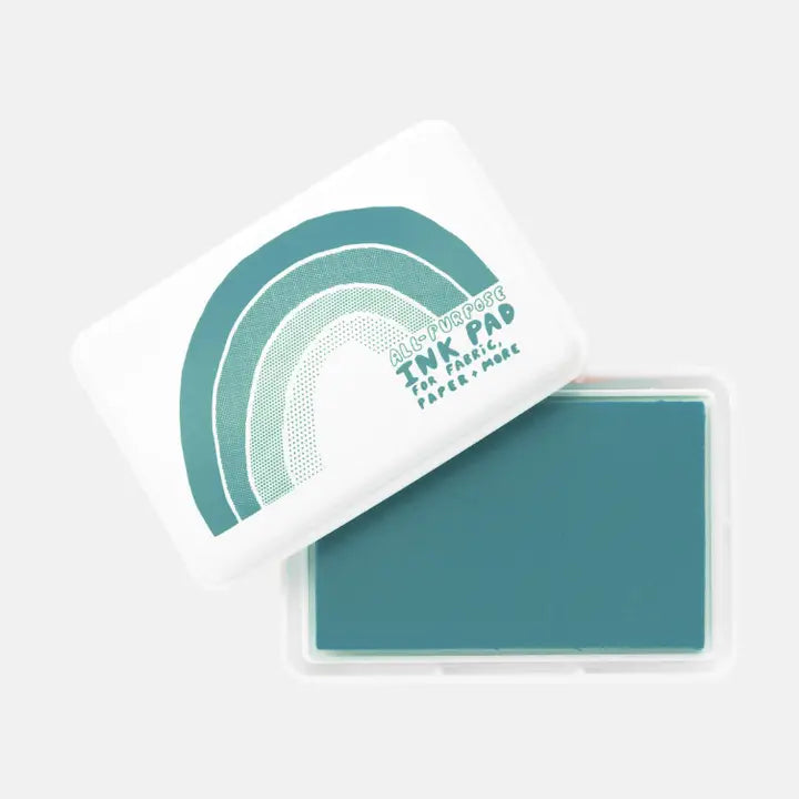 Teal ink pad with a matching stamp on a white background