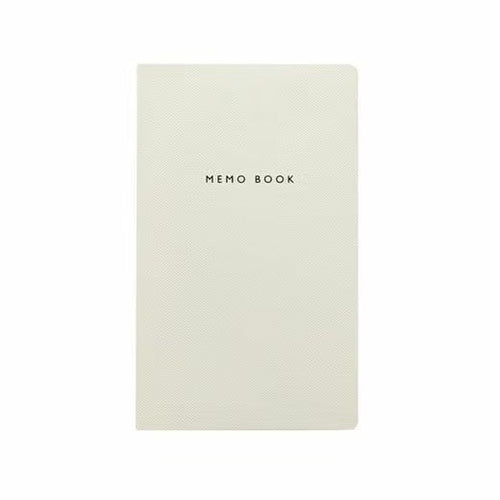 Memo book with textured cover on a white background