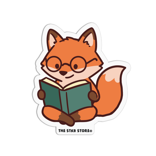 Sticker of a fox wearing glasses and reading a book, with 'The Stkr Store' logo below.