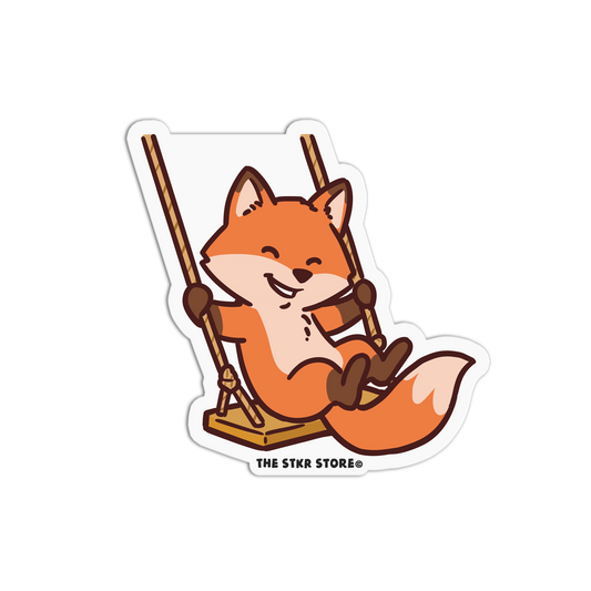 Cartoon fox on a swing with 'The Stkr Store' logo