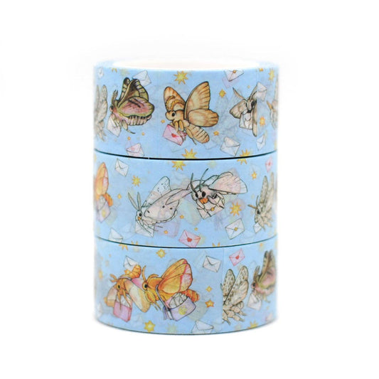 Set of washi tape rolls with butterfly design on a light blue background