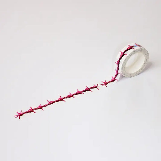 Roll of pink barbed wire on a white background