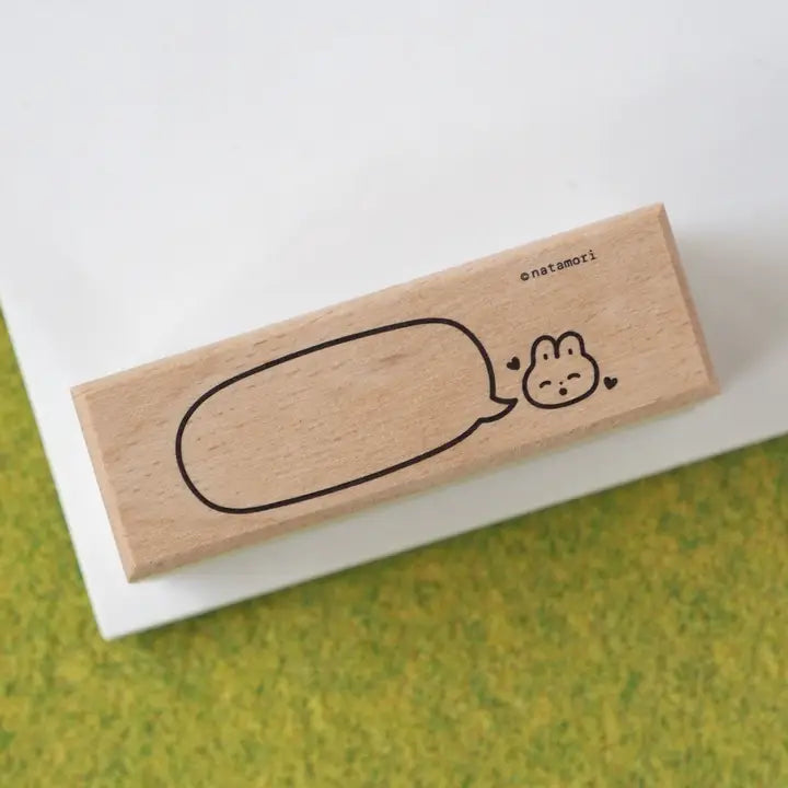 Wooden stamp with a cute design on a white background