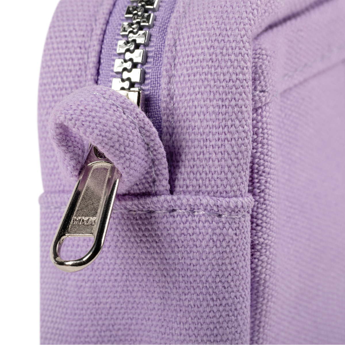 Close-up of a purple fabric with a metal zipper pull.