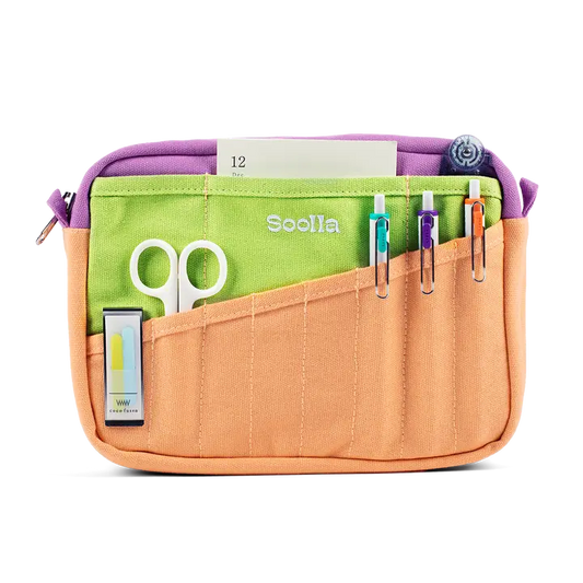 Multicolored organizer bag with scissors and stationery items on a white background