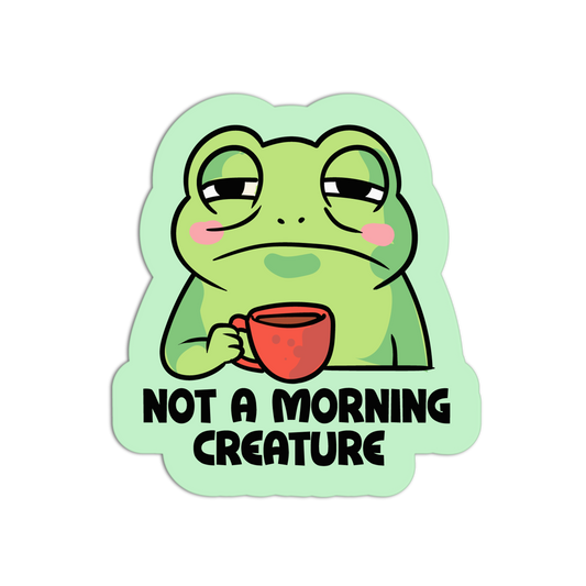 Cartoon frog holding a red mug with 'Not a Morning Creature' text on a light green background