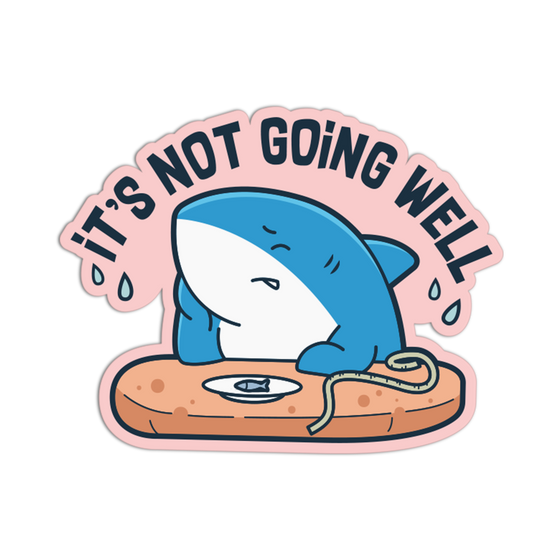 Sticker with a blue shark on a surfboard and text 'It's Not Going Well' on a pink border.