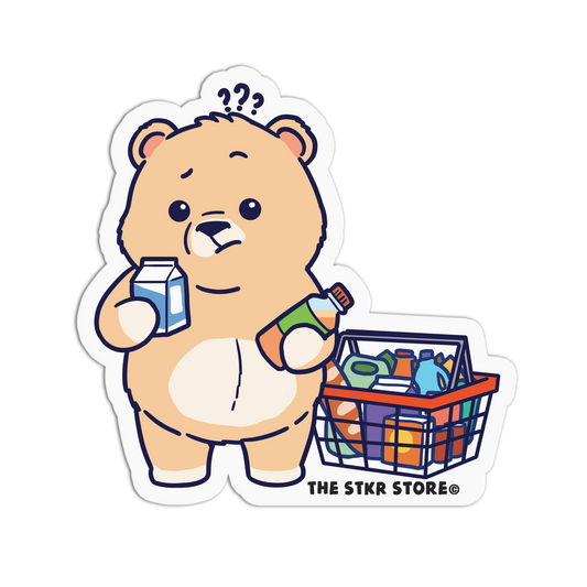 Cartoon bear holding a milk carton and bottle, with a shopping basket, on a white background. Brand 'THE STKR STORE' visible.