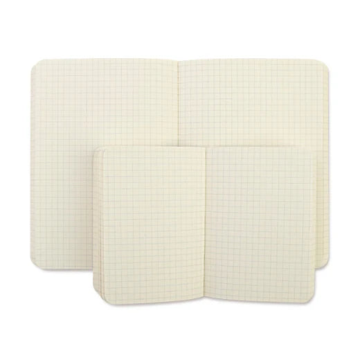 Two cream-colored notebooks with grid patterns on a white background