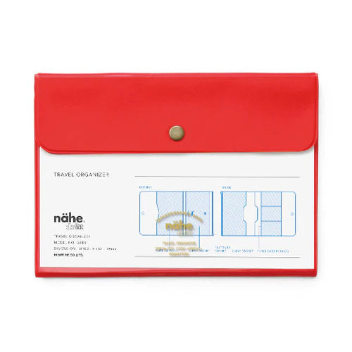 Red travel organizer with a clear flap on a white background