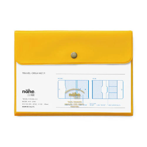 Yellow travel organizer with a button on top, featuring the brand 'nähe'.