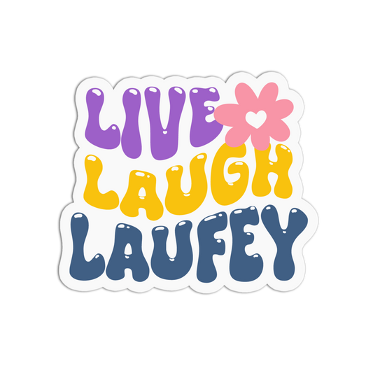 A die-cut vinyl sticker featuring the text 'LIVE LAUGH LAUFETY' in a retro, bubbly font. The words are colored purple, yellow, and blue, with a pink flower containing a white heart replacing the 'O' in 'LAUGH'.