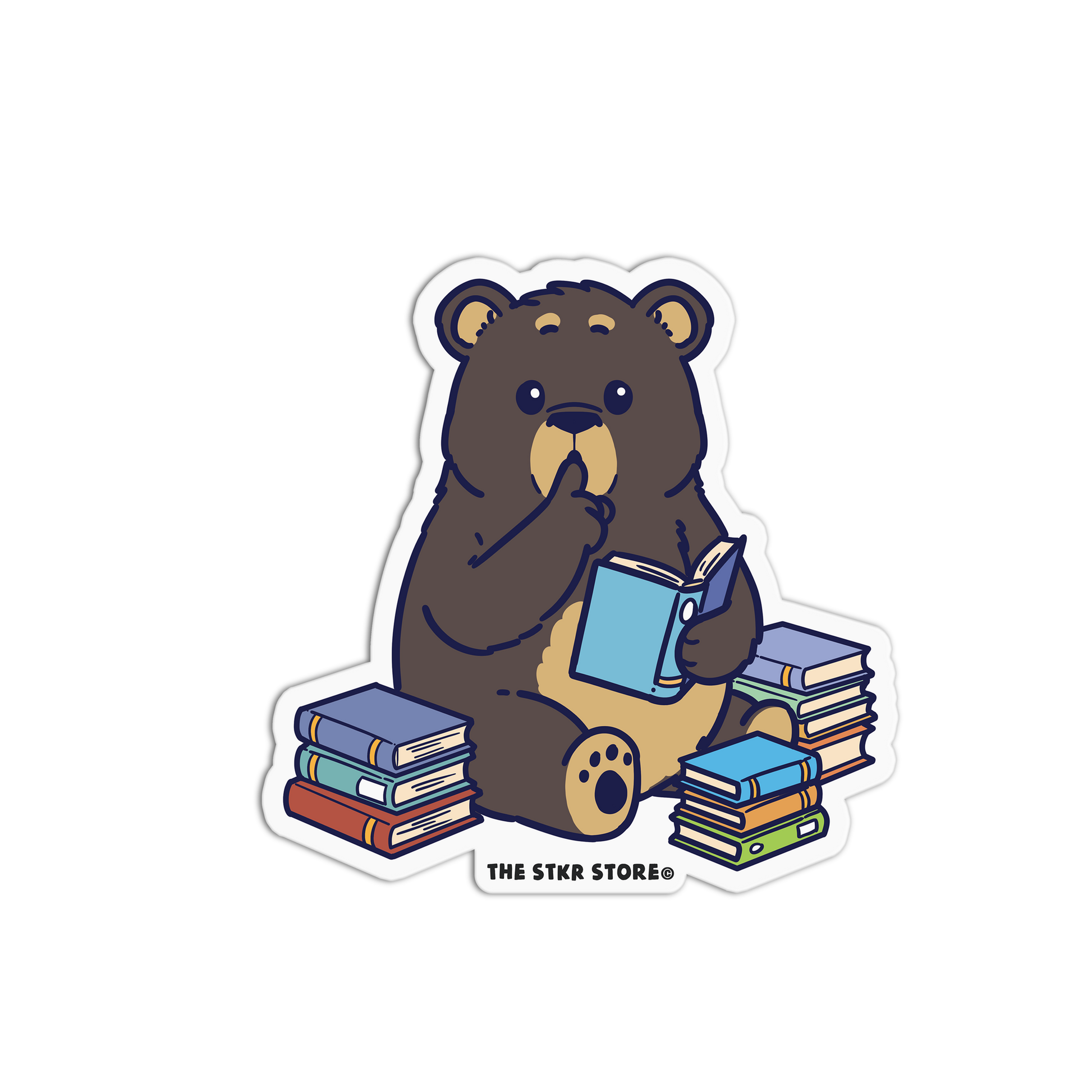 Sticker of a bear reading a book with books around it, from The Stkr Store.