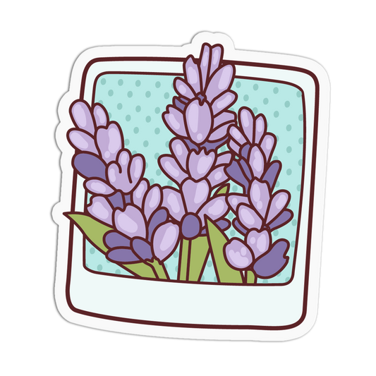 A die-cut sticker featuring a cartoon-style illustration of lavender flowers inside a Polaroid-style photo frame, shown on a plain white background.
