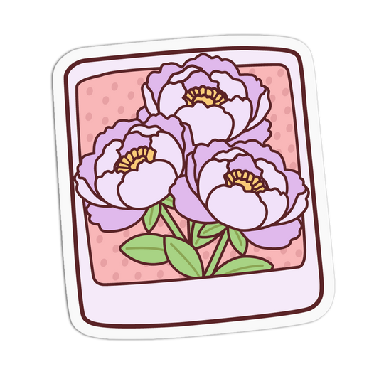 A square sticker or decal with rounded corners featuring an illustration of three light purple peony flowers with green leaves on a pink dotted background, framed by a white border and dark brown inner border.