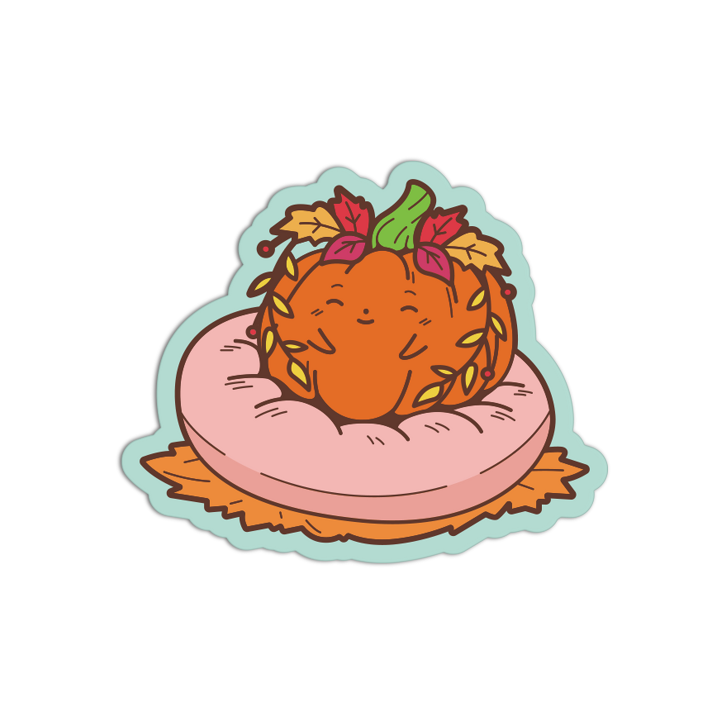 A die-cut sticker featuring a cute cartoon illustration of a smiling orange pumpkin resting on a pink cushion with autumn leaves and a green stem, shown on a plain white background.