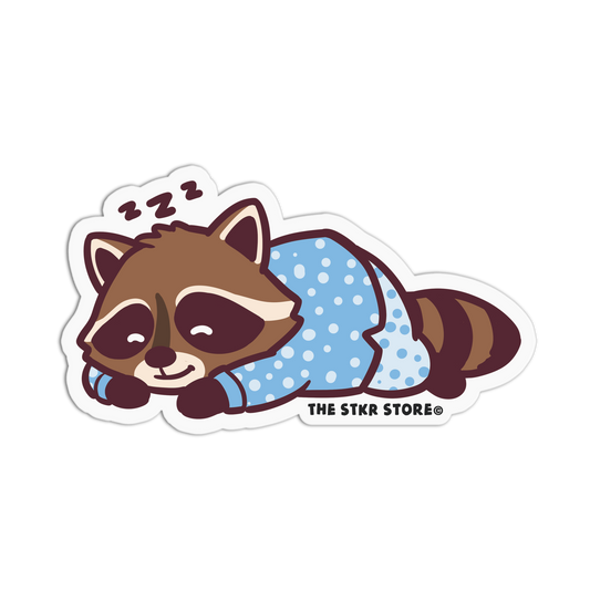 Sticker of a raccoon in a blue onesie with 'ZZZ' on a white background, from The STKR Store.