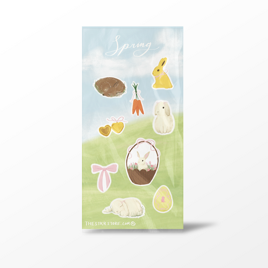 Pack of spring-themed stickers with bunnies, eggs, and carrots on a light blue and green background.