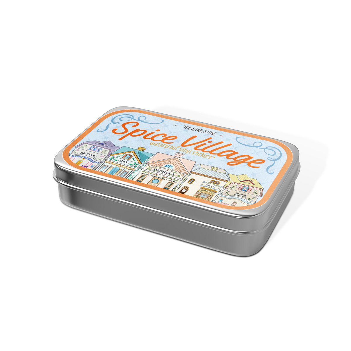 A rectangular silver metal tin with rounded corners, featuring a colorful illustrated label on the lid that reads 'Spice Village' with small shop drawings. The tin is photographed on a clean white background with a soft shadow.