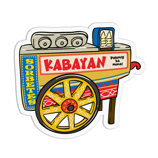 A die-cut sticker featuring a colorful cartoon-style street cart with the word “KABAYAN” in large red letters and additional decorative text and patterns, shown on a plain white background.