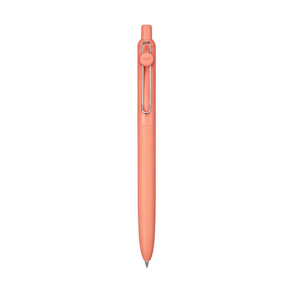 Coral-colored pen on a white background