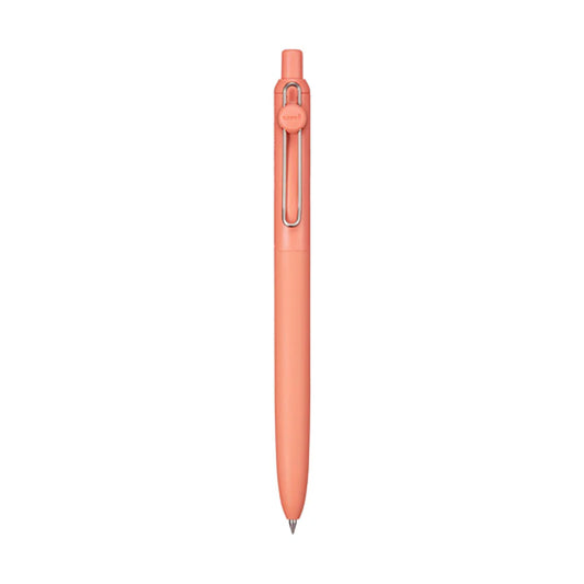 Coral-colored pen on a white background