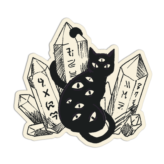 Black cat surrounded by crystals on a beige background